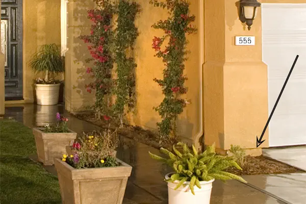 Weep screed showing proper clearance above soil level